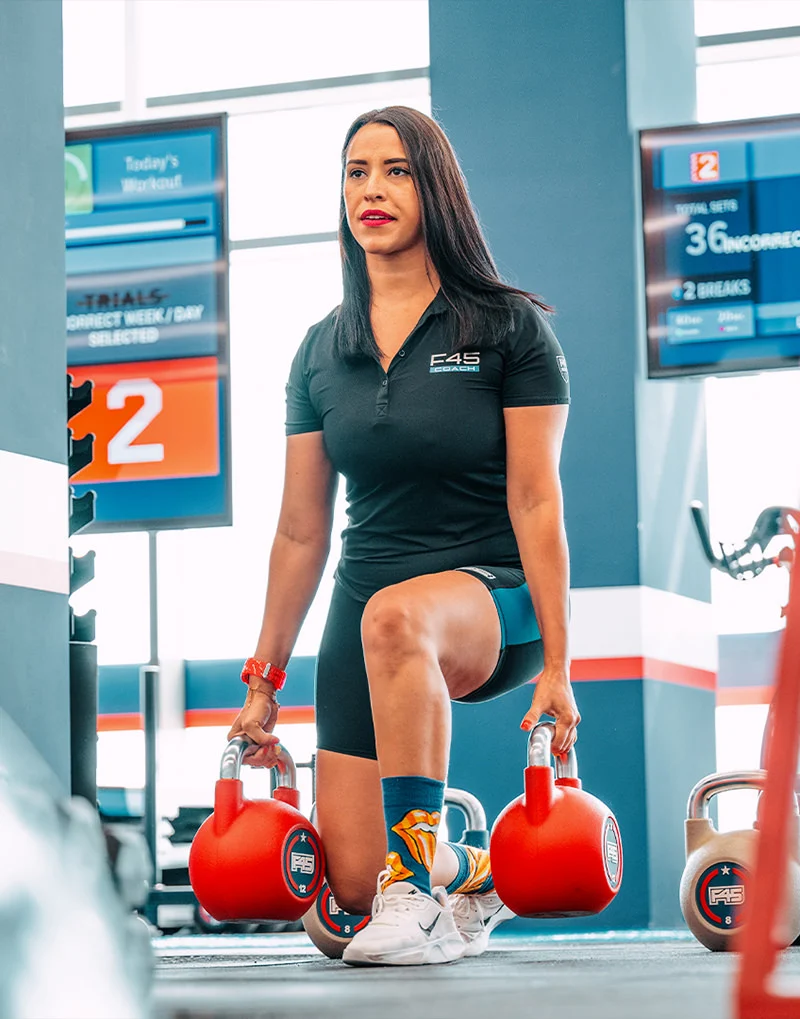A woman training at F45